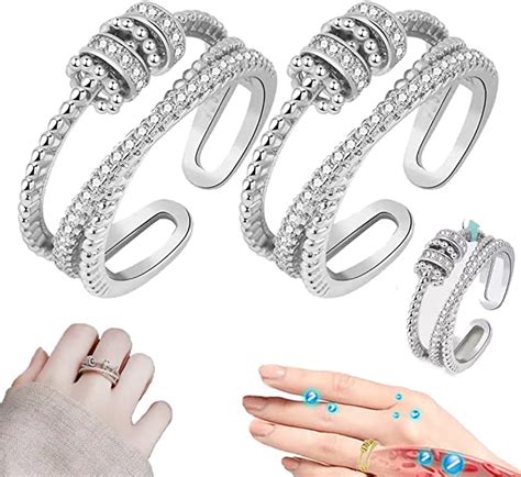 JANSIO Threanic Triple-Spin RingA dainty fidget jewelry featuring a distinct interwoven silver band design with 7 smart movable beads. . Jansio threanic